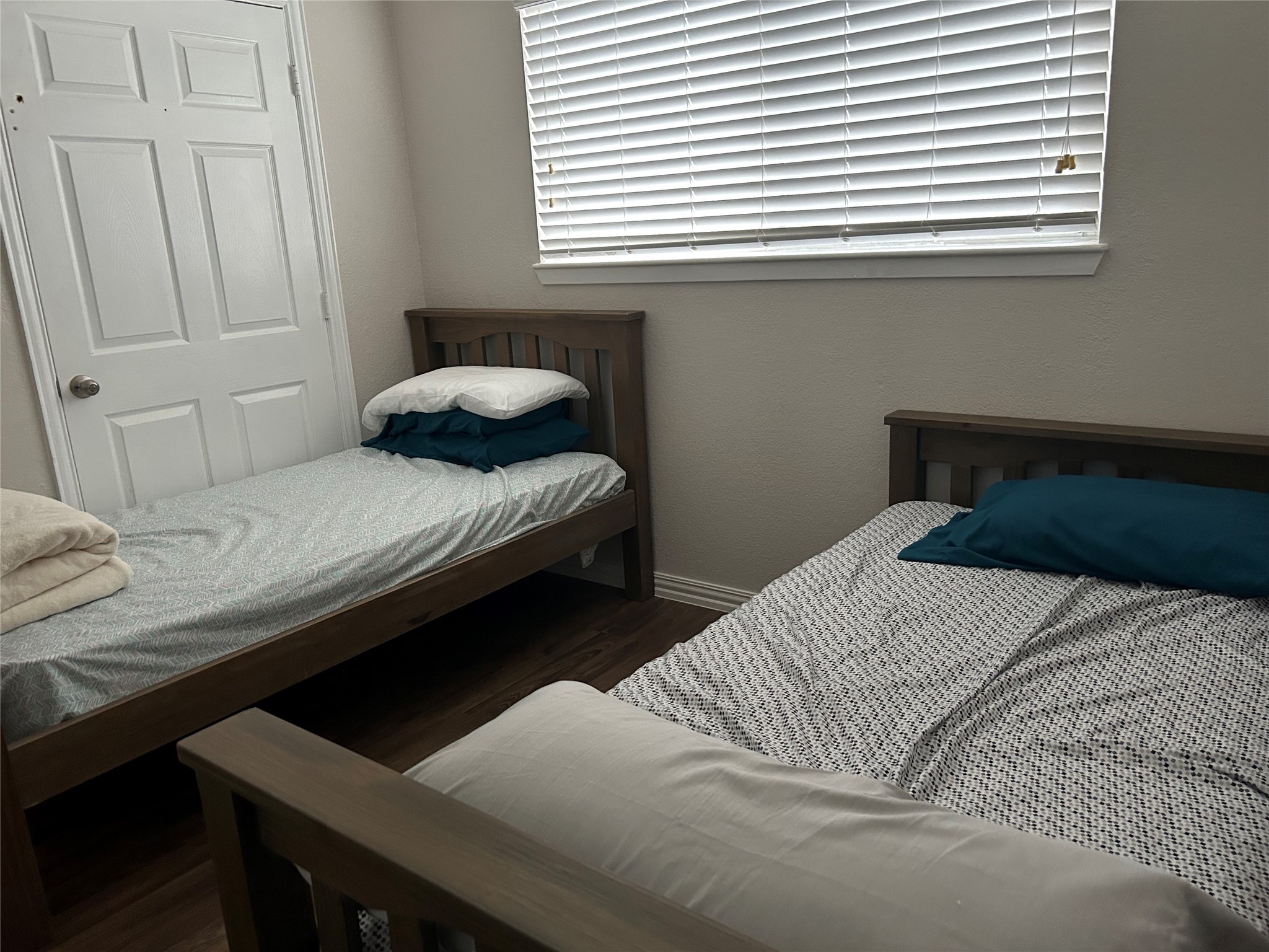 306 Isles End Road Tiki Island, TX 77554 - Photo 17 of 25 a bedroom with a bed and a window