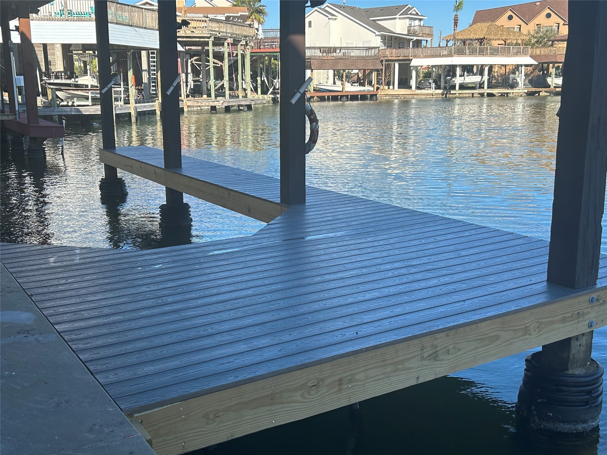 306 Isles End Road Tiki Island, TX 77554 - Photo 22 of 25 a view of a lake from a balcony
