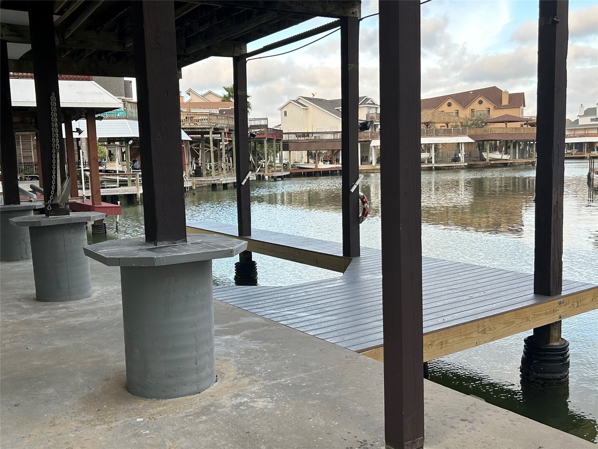 306 Isles End Road Tiki Island, TX 77554 - Photo 23 of 25 a view of a living room and floor to ceiling window