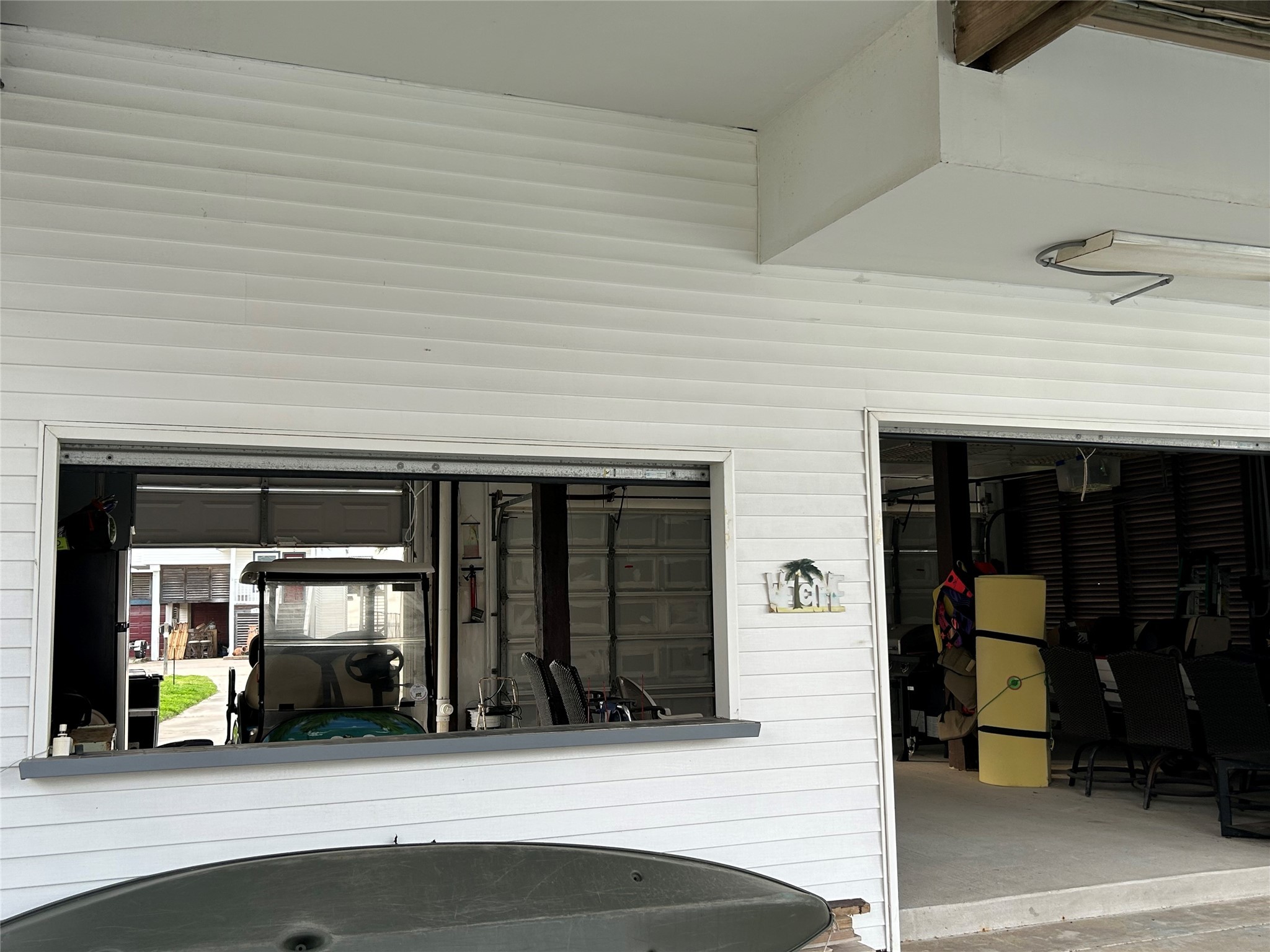 306 Isles End Road Tiki Island, TX 77554 - Photo 25 of 25 a view of a car garage of the house