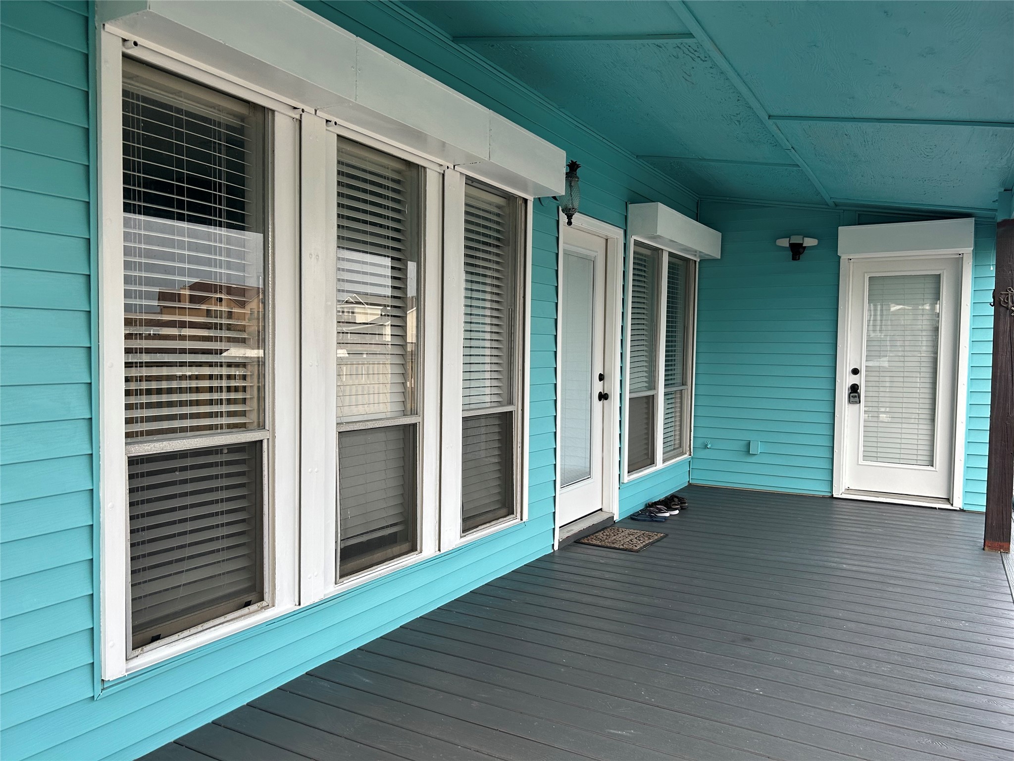 306 Isles End Road Tiki Island, TX 77554 - Photo 5 of 25 a view of a porch with wooden floor and a window
