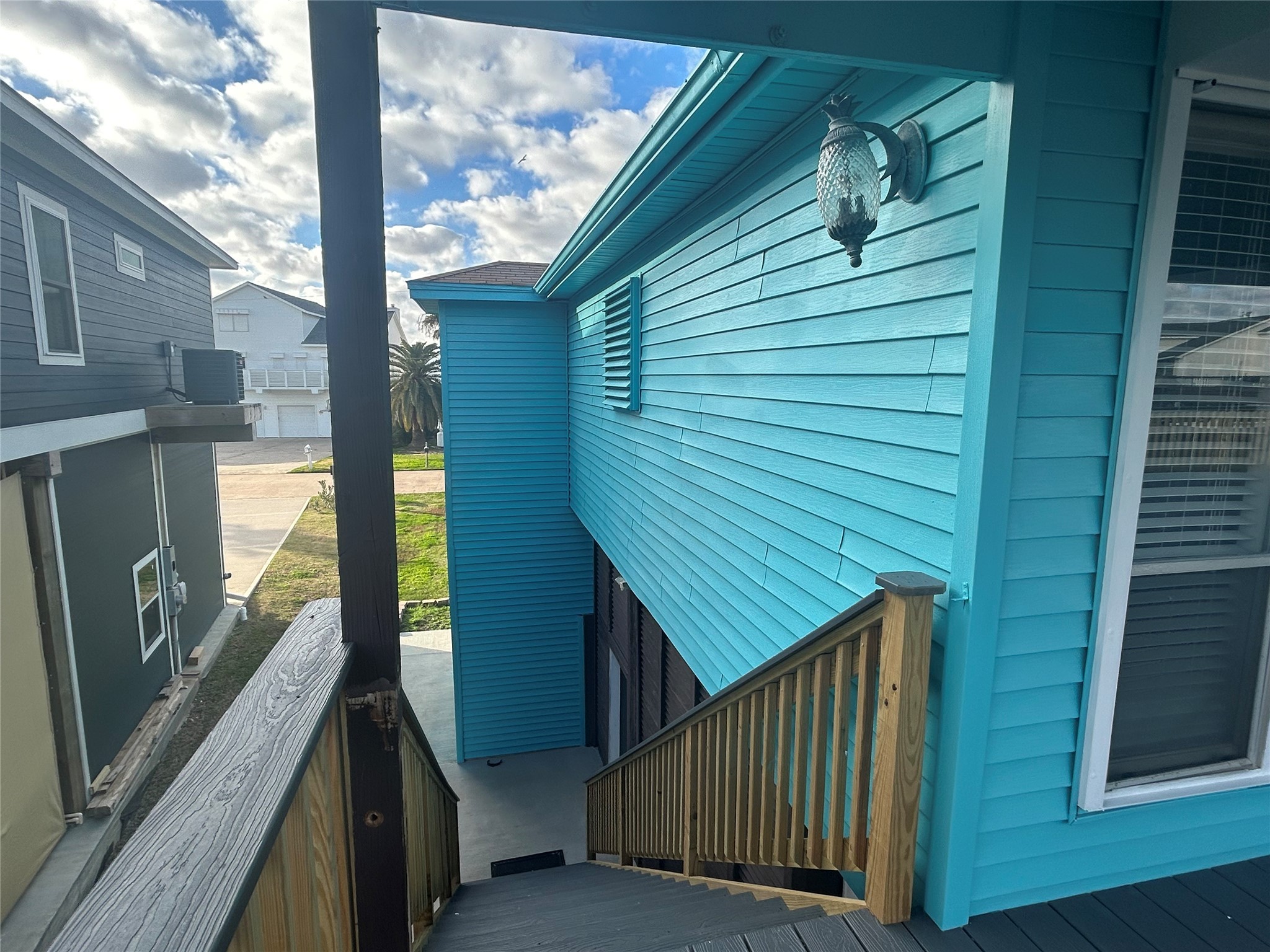 306 Isles End Road Tiki Island, TX 77554 - Photo 8 of 25 a view of a balcony with wooden floor