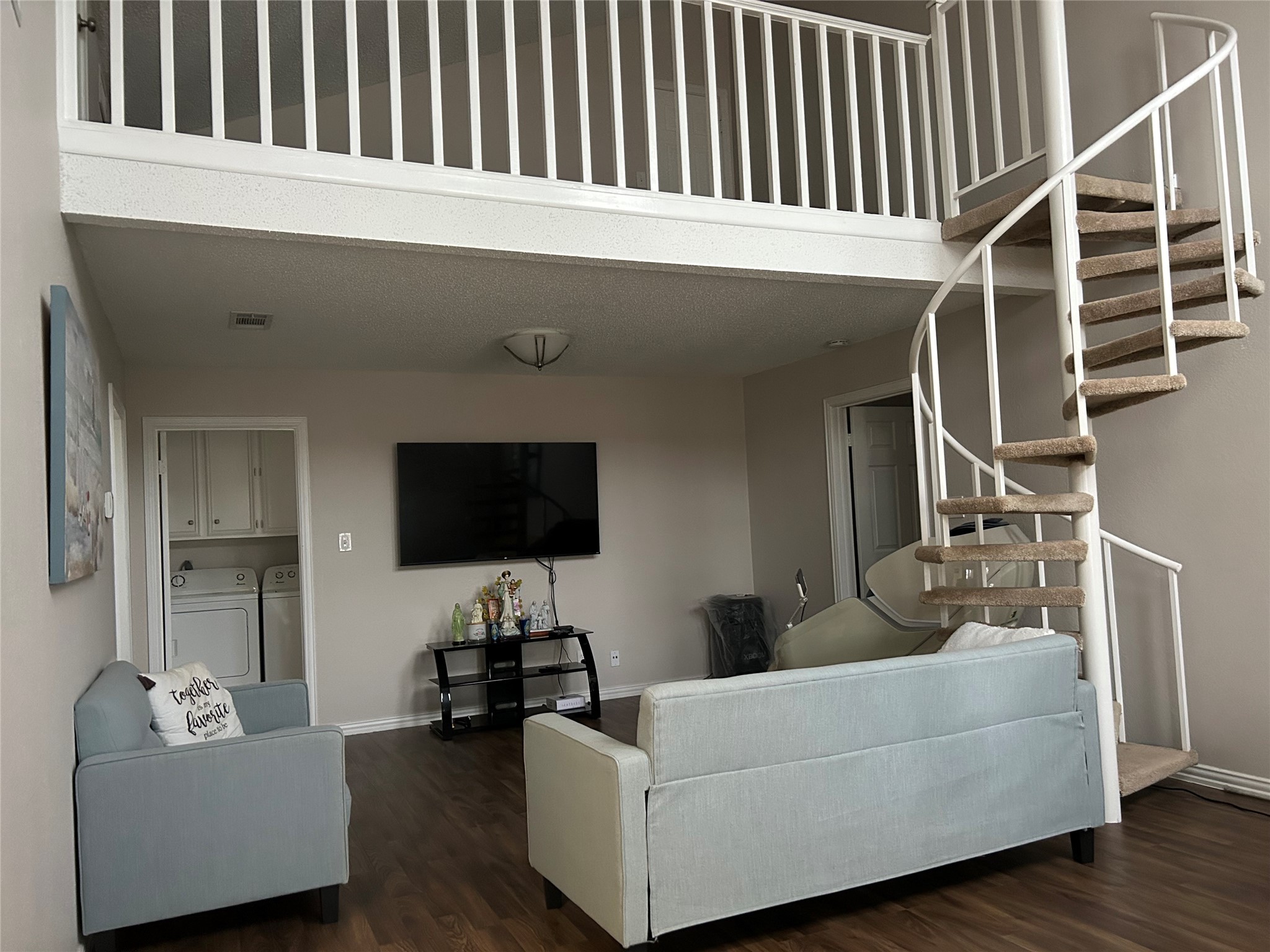 306 Isles End Road Tiki Island, TX 77554 - Photo 9 of 25 a living room with furniture and a flat screen tv