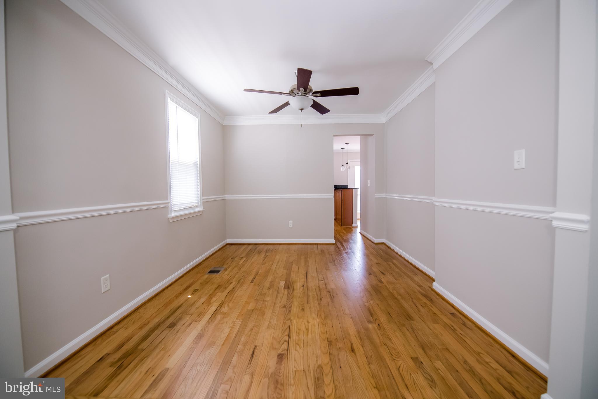 24 Crafton Road Essex, MD 21221 - Photo 8 of 28 Hardwood in the dining room