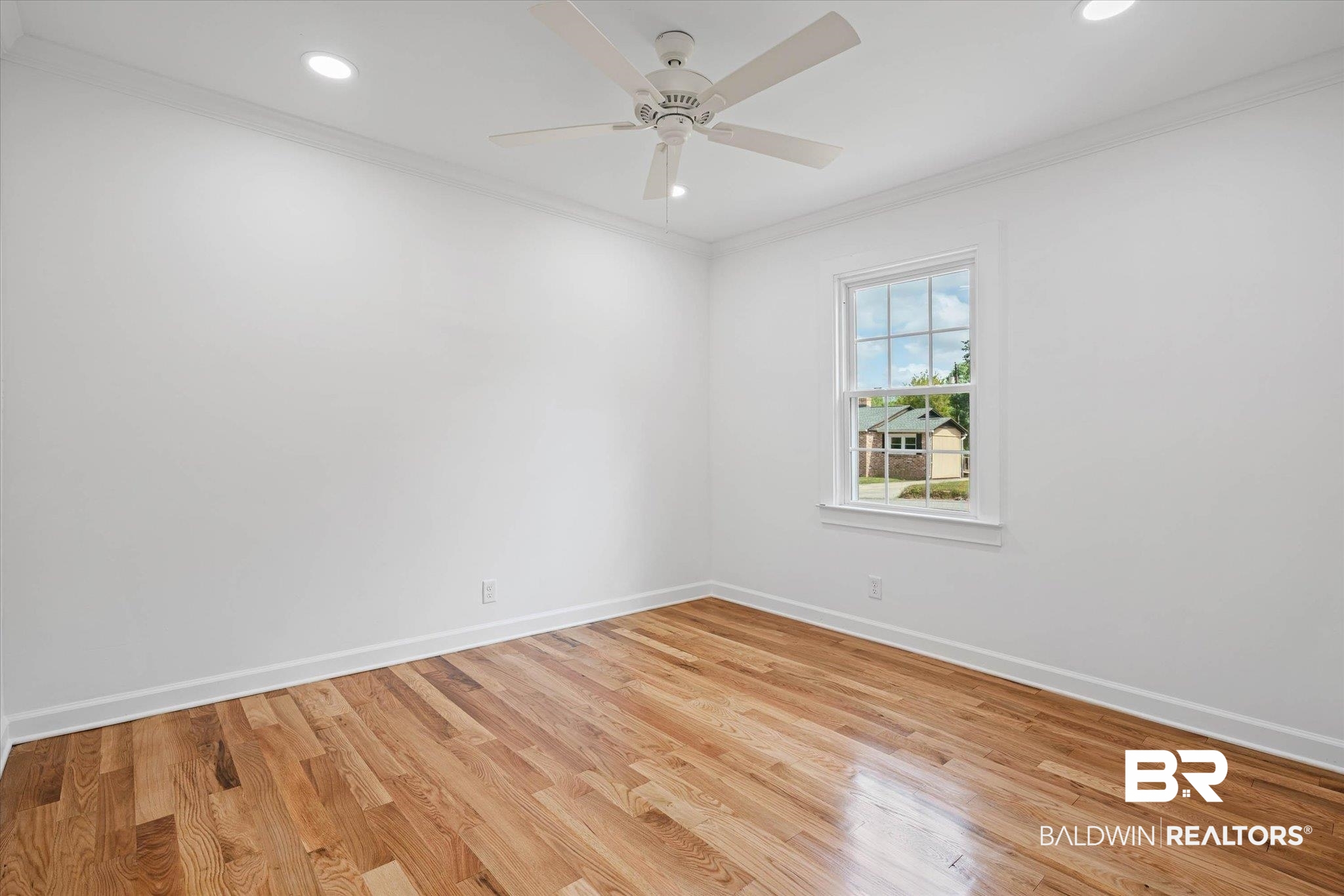 41 Hathaway Road West Mobile, AL 36608 - Photo 9 of 24 Spare room featuring light wood-style floors, recessed lighting, crown molding, and ceiling fan