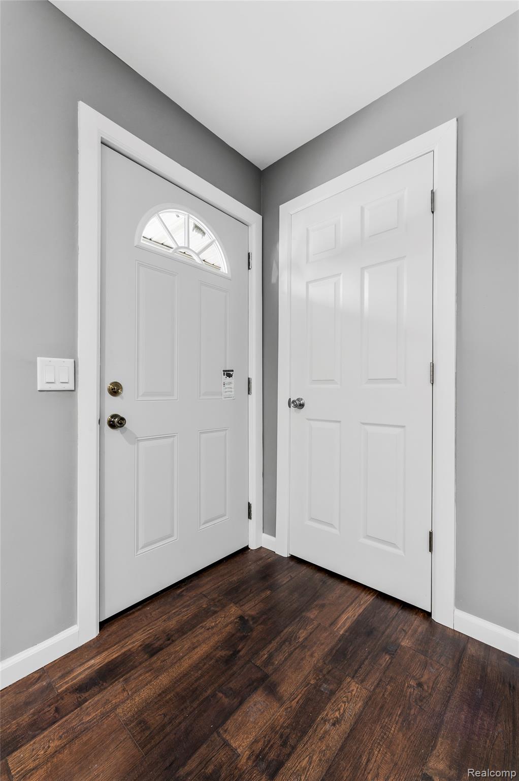 13515 Lenmoore Road Belleville, MI 48111 - Photo 6 of 41 Entryway with baseboards and dark wood-style floors