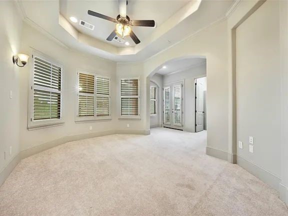 910 Snover Street, Unit A Houston, TX 77007 - Photo 14 of 26 an empty room with windows and ceiling fan