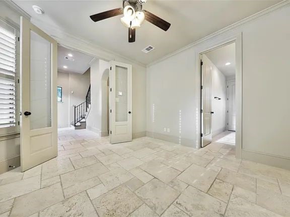910 Snover Street, Unit A Houston, TX 77007 - Photo 21 of 26 a view of a hallway with closet and a chandelier fan