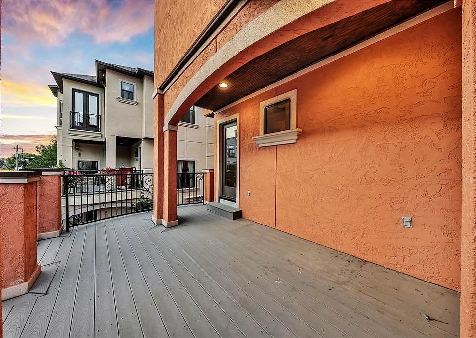 910 Snover Street, Unit A Houston, TX 77007 - Photo 24 of 26 a view of a porch with wooden floor and fence