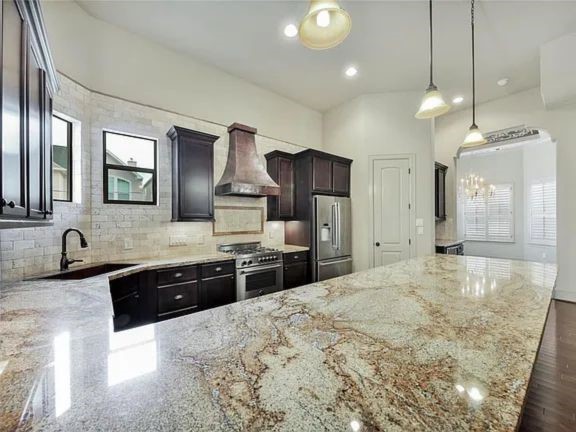 910 Snover Street, Unit A Houston, TX 77007 - Photo 6 of 26 a large kitchen with kitchen island a sink stainless steel appliances and cabinets