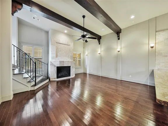 910 Snover Street, Unit A Houston, TX 77007 - Photo 7 of 26 a view of a hallway with wooden floor and a fireplace
