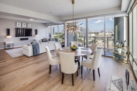 a view of a dining room with furniture window and wooden floor