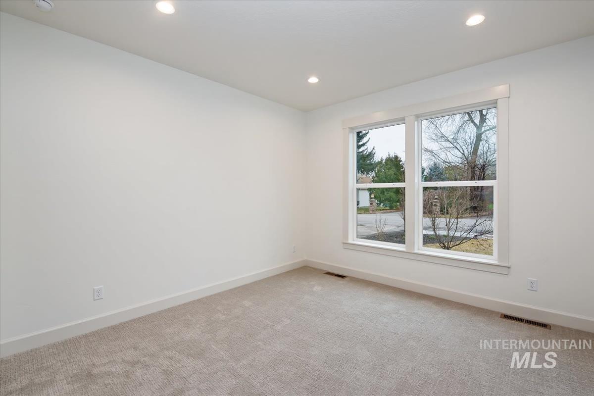 3300 North 39th Street Boise, ID 83703 - Photo 26 of 49 Empty room featuring carpet flooring and recessed lighting
