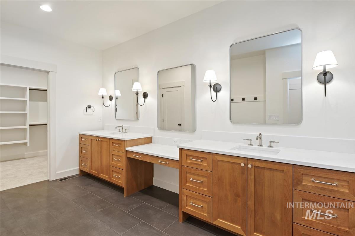 3300 North 39th Street Boise, ID 83703 - Photo 6 of 49 Full bath featuring vanity, a walk in closet, dark tile patterned flooring, and recessed lighting
