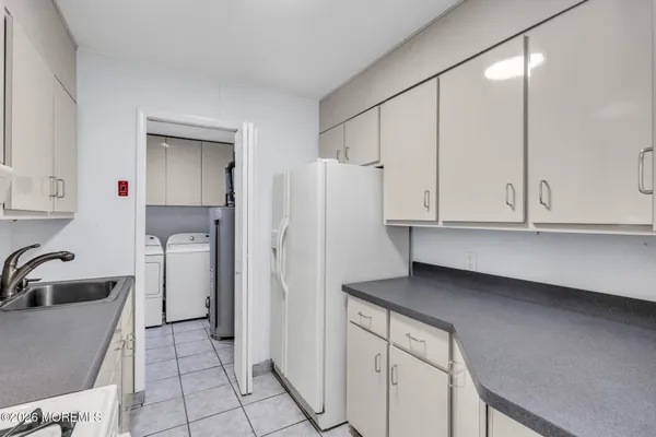 a kitchen with a sink stove and refrigerator