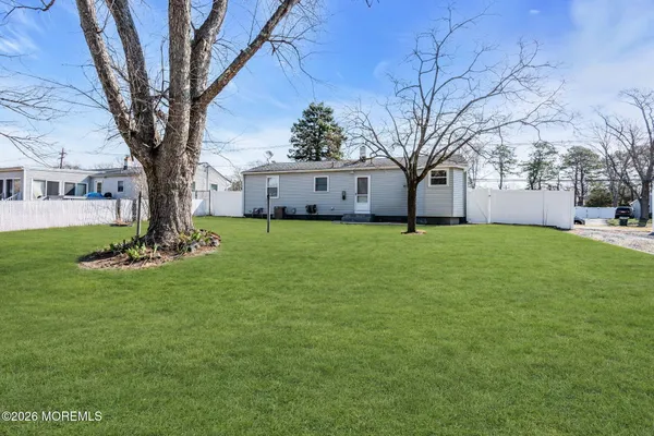 a house with trees in the background