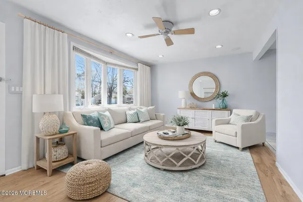 a living room with furniture and a large window