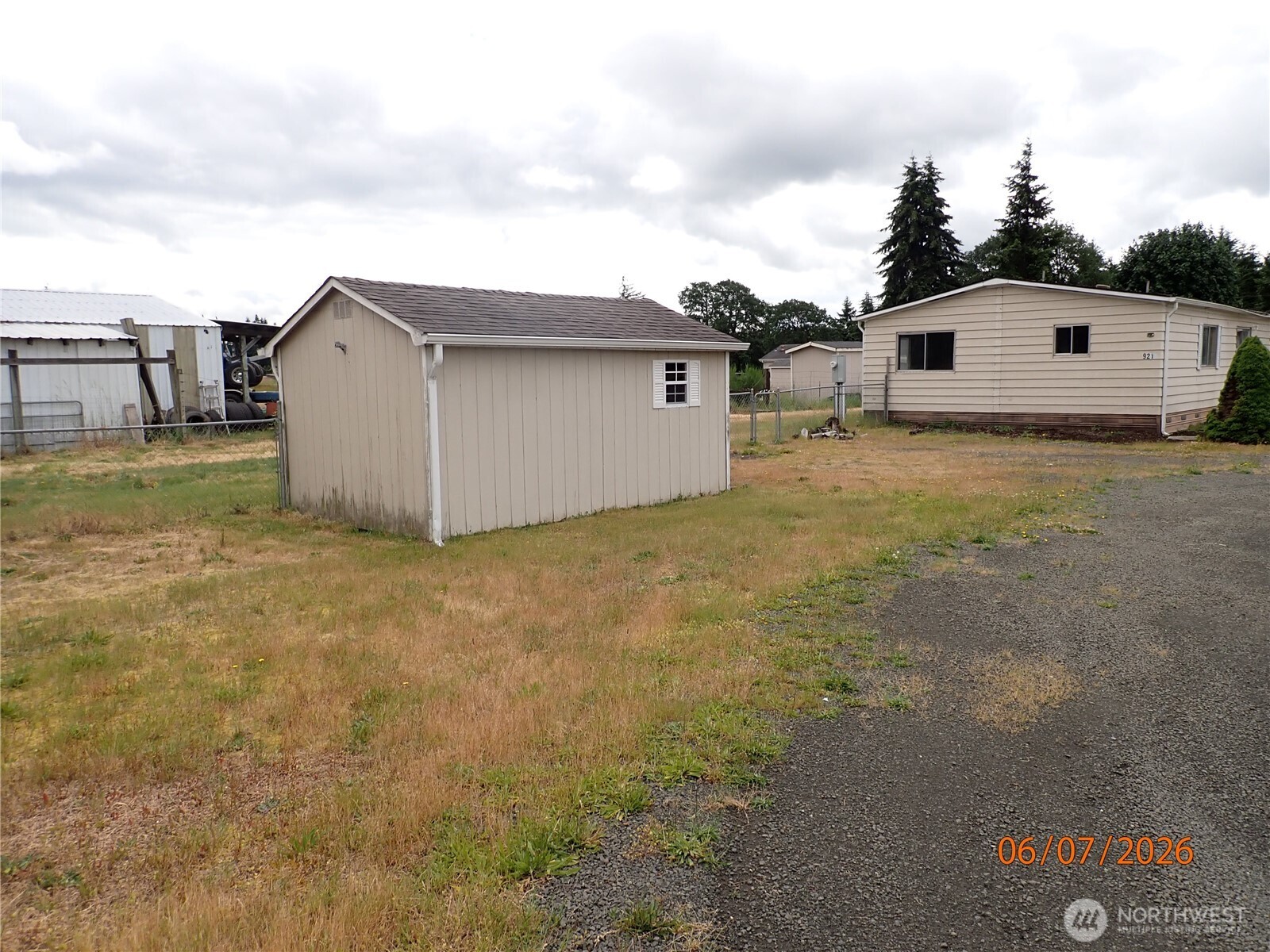 9217 183rd Avenue Southwest Rochester, WA 98579 - Photo 4 of 26 a view of a house with backyard and trees