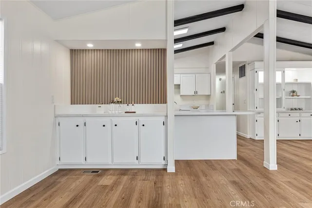 a view of cabinets with wooden floor