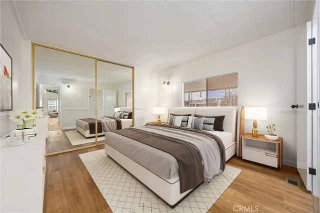 a large bedroom with a bed and a couch