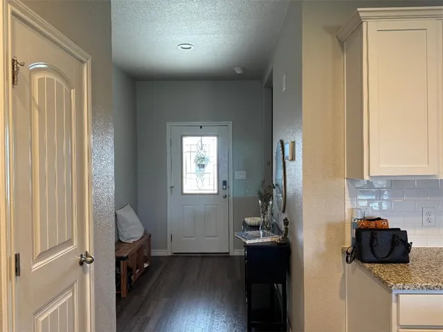 a view of a livingroom with a lounge chair