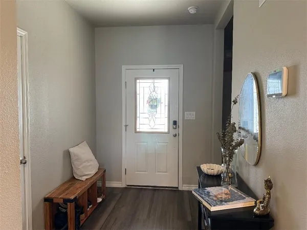 a room with furniture and wooden floor