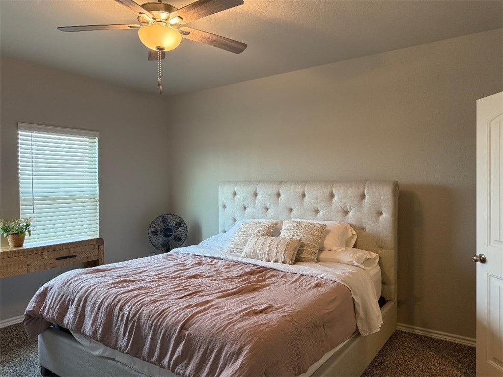 2662 Excelsior Boulevard Corpus Christi, TX 78415 - Photo 14 of 40 a bedroom with a bed and a chandelier