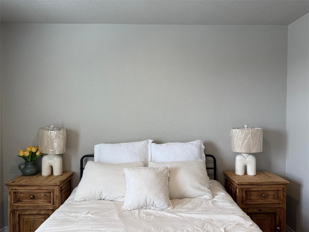 2662 Excelsior Boulevard Corpus Christi, TX 78415 - Photo 33 of 40 a bed room with a bed window and a lamp