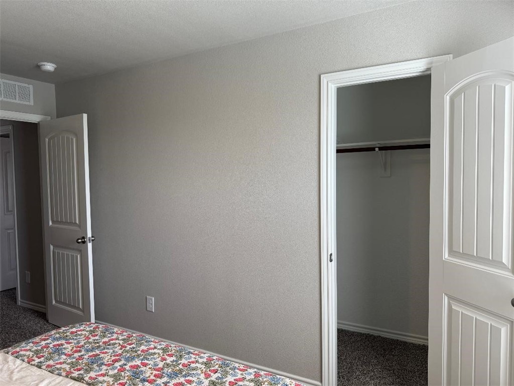 2662 Excelsior Boulevard Corpus Christi, TX 78415 - Photo 34 of 40 a bedroom with a bed and a table