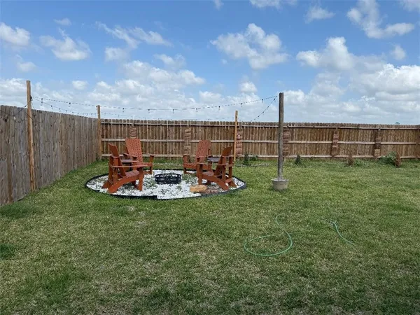 a backyard of a house with lots of green space