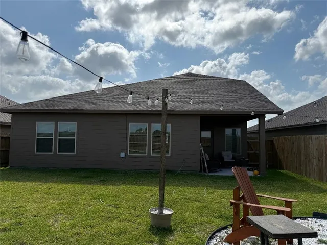 a backyard of a house with seating space