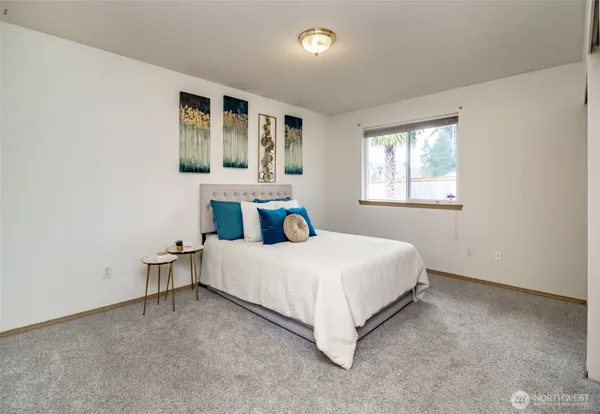 a bedroom with a bed and window