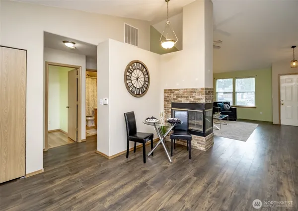 a view of a dining room with furniture window and wooden floor