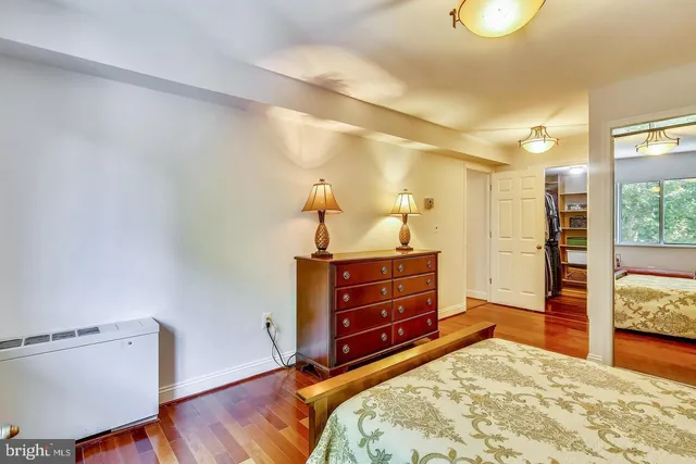 a bedroom with a bed and a table