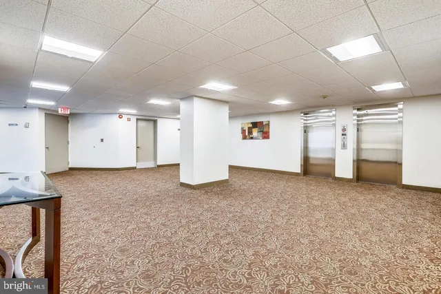 a view of a swimming pool with an outdoor seating