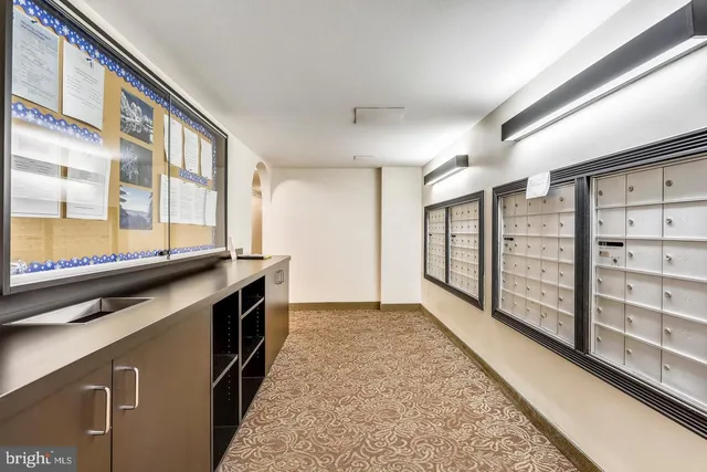 a view of building with cars parked