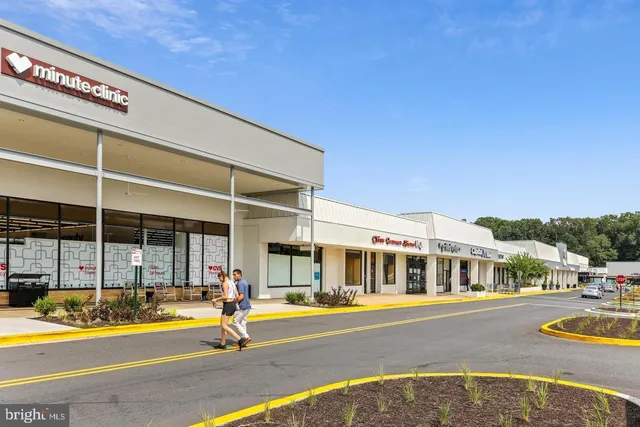 a view of a street with cars parked