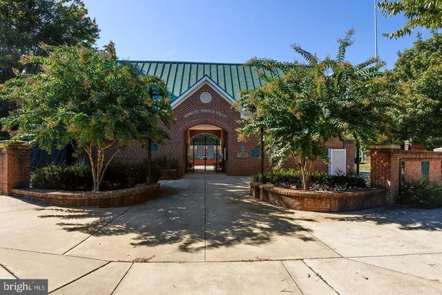 a outdoor view with a swimming pool and sitting space
