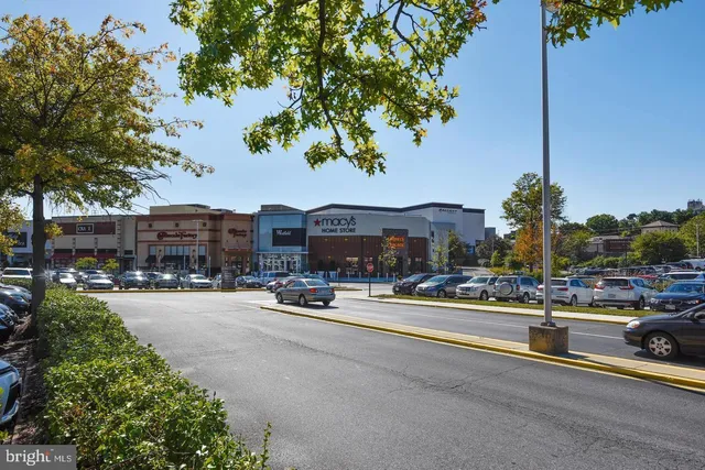 a utility room with cabinets washer and dryer