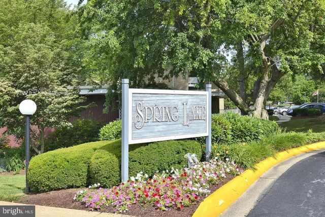 a view of a lake with houses in the back