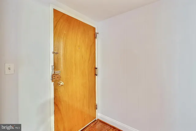 a view of kitchen with furniture and wooden floor
