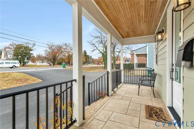 a view of a balcony with wooden floor