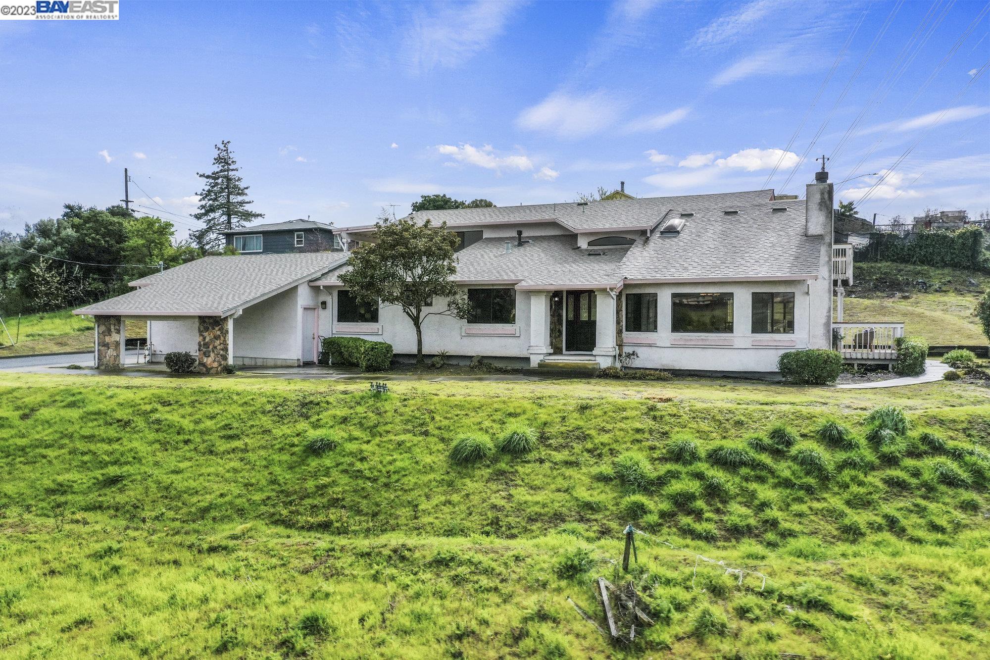 a front view of a house with a yard table and chairs