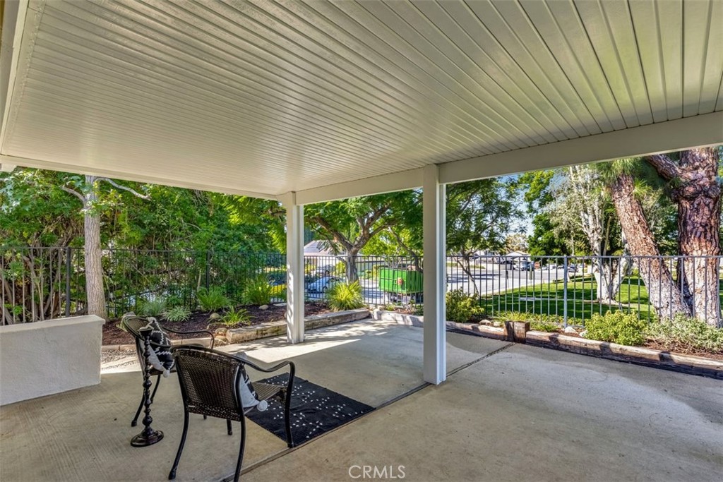 23211 Meadowbrook Circle Lake Forest, CA 92630 - Photo 19 of 50 a view of a patio with a table chairs and a backyard