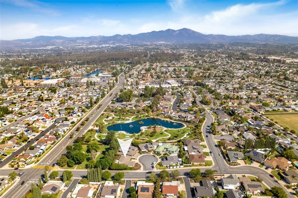 23211 Meadowbrook Circle Lake Forest, CA 92630 - Photo 2 of 50 a view of a lush green field with mountains in the background