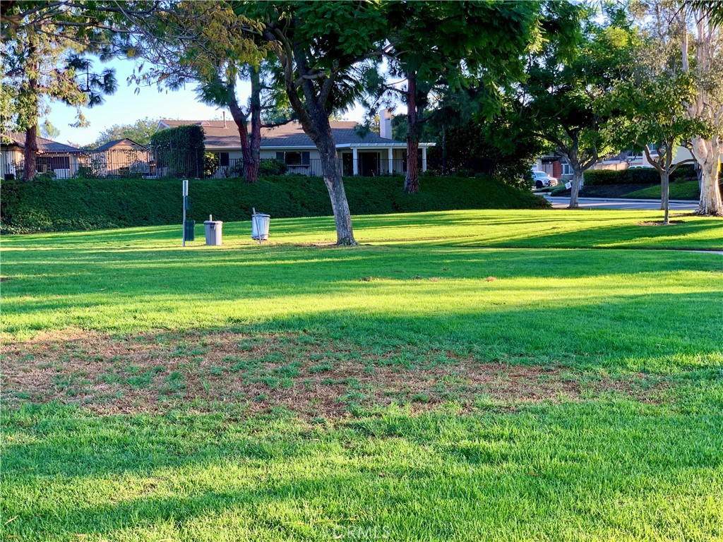23211 Meadowbrook Circle Lake Forest, CA 92630 - Photo 42 of 50 a front view of a house with a yard
