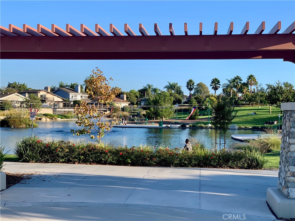 23211 Meadowbrook Circle Lake Forest, CA 92630 - Photo 45 of 50 a front view of a house with a yard and potted plants