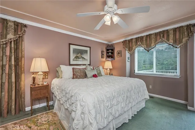a living room with furniture and a bookshelf