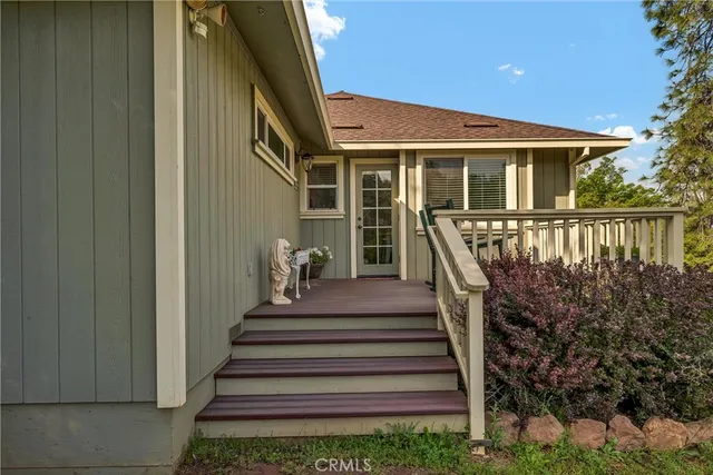 a view of a patio with couches chairs and potted plants