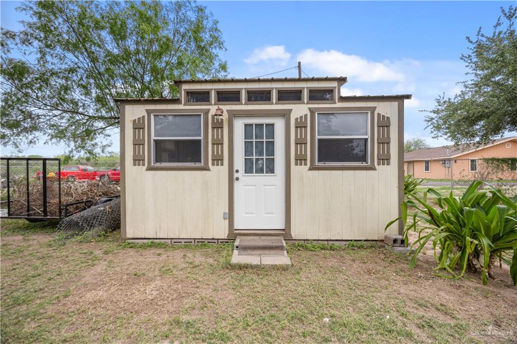 6020 North Doolittle Road Edinburg, TX 78542 - Photo 14 of 23 Freestanding auxiliary structure featuring vertical siding and a single entry door
